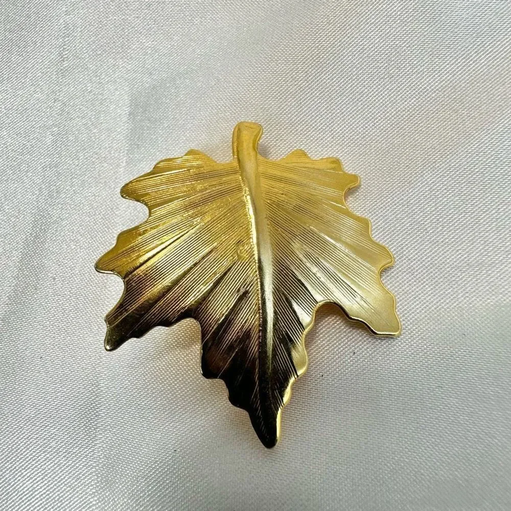 Gold tone leaf pin